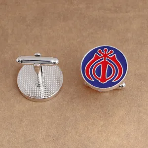 Detailed view of men round metal enamel cufflinks featuring blue red symbol and T-bar back.