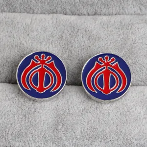Close-up detail of vintage round enamel cufflinks featuring unique religious symbol design.