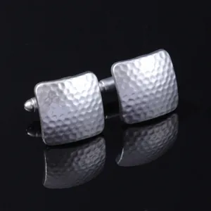 Silver square hammered cufflinks detail view, metal business men suit accessories.