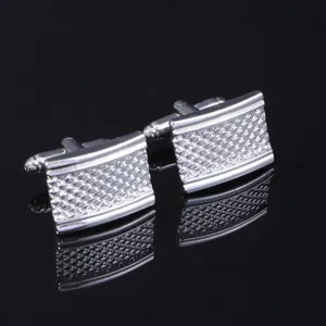 Men's silver tone metal square cufflinks with textured grid pattern for business formal wear.