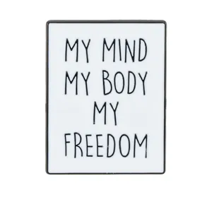 Metal enamel pin with inspirational quote, minimalist black and white geometric design.