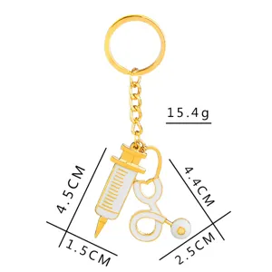 Gold-colored metal keychain featuring a creative syringe and stethoscope pendant, lightweight and stylish.