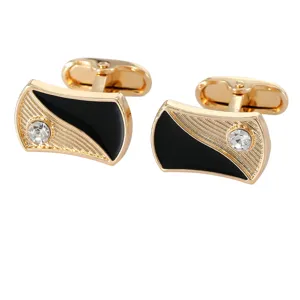 Élégants boutons de manchette dorés pour homme avec émail noir et strass pour chemise.