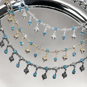DIY multi-color rhinestone and heart charm chain, detailed view of blue crystal jewelry findings.