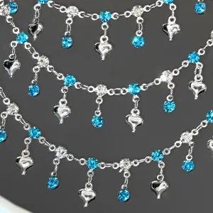 DIY rhinestone chain with blue crystal hearts, silver layered metal necklace and waist accessory.