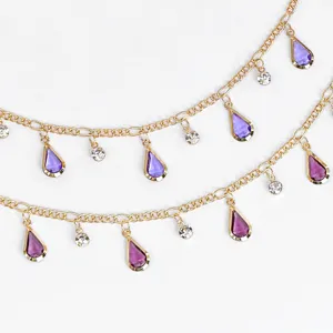 Gold-tone chain with light purple teardrop crystals and rhinestones for DIY jewelry parts.