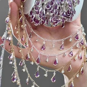 DIY teardrop rhinestone chain jewelry accessory, elegant purple crystal links for craft projects.