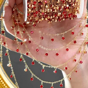 DIY gold rhinestone chain with red crystal drops for handmade jewelry, bracelets, and necklaces.