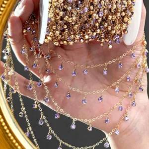 Gold tone DIY chain with purple rhinestone charms, detailed view of handmade jewelry accessory.