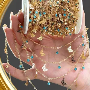 Gold DIY chain featuring sparkling blue rhinestones and delicate butterfly charms for jewelry.