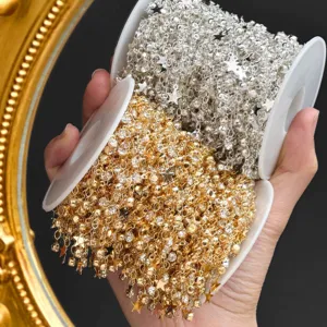 Close-up of DIY star and bead craft chains in gold and silver for handmade accessories.