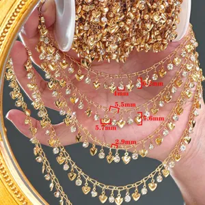 Close-up detail of DIY gold rhinestone heart chain crafting material for hair accessories.
