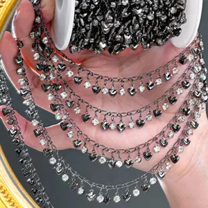 DIY black metal chain with sparkling heart pendants and rhinestones, ideal for crafts.