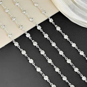 Close up view of sparkling rhinestone chain details, perfect for DIY jewelry and crafts.