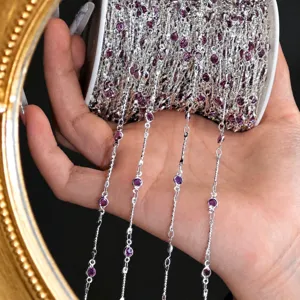 Detail of DIY silver chain with purple stone bezels, perfect for antique hair accessories.