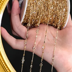 Gold rhinestone cup chain spool detail shot, DIY jewelry making and hair accessory materials.