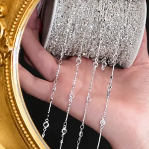 Close up view of shiny 4mm silver jewelry chain roll detail for DIY craft hair accessories.