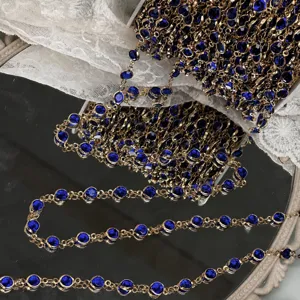 Detailed closeup view of 6mm blue rhinestone chain, antique style DIY craft accessory.