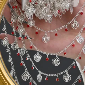 DIY silver metal chain tassel accessories with hollow rose charms and red rhinestones.