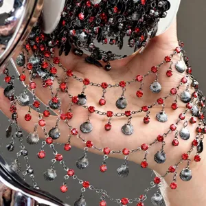 DIY red rhinestone shell chain detail closeup for handmade doll clothes jewelry accessories