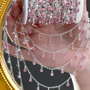 Detailed view of silver DIY chain with sparkling pink rhinestones for handmade jewelry and crafts.