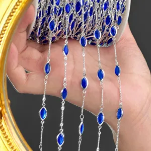 Detailed view of DIY silver-toned craft chain featuring sparkling royal blue navette rhinestones.