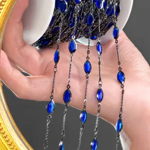 Detailed close-up of blue marquise stone chain, perfect for DIY jewelry and chic hair tassels.