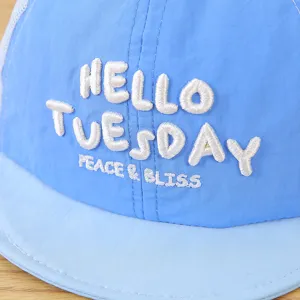 Close-up detail of children's blue mesh baseball cap with 3D white embroidered text.