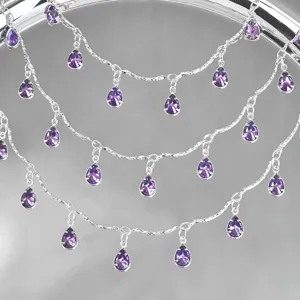 Detailed shot of silver-tone DIY chain featuring sparkling light purple teardrop zircon charms.