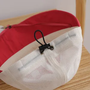 Mesh sun hat detail view showing breathable white fabric, adjustable cord, and inner lining.