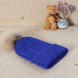 Women winter warm knitted beanie hat with faux fur pom pom, casual thick slouchy wool cap.