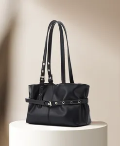 Stylish black PU leather tote shoulder bag with metal buckles, retro commuter handbag detail.