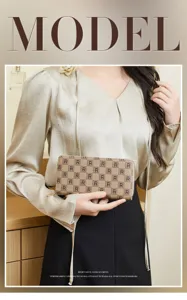 Detailed view of women's printed clutch wallet, featuring classic monogram design and secure zipper.