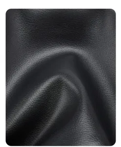 Black leather bag detail close-up, premium texture and fine grain finish for women.