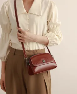 Detailed view of the retro oil-wax leather shell crossbody bag with multi-compartments.