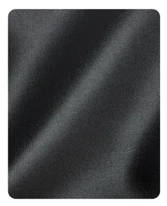 Close-up detail showing the premium black leather texture and fine grain of the bag.