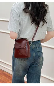 Detailed view of the trendy retro brown crossbody bag, perfect for daily wear and phone.