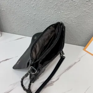 Black punk envelope shoulder bag with metal chain strap and inner zipper compartments.