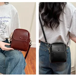 Fashionable small crossbody bag with flap and button closure. Versatile shoulder bag.