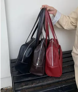 Detailed view of large capacity PU leather shoulder boston bag in multiple classic colors.