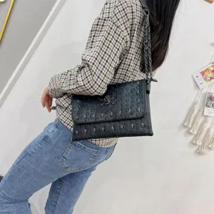 Punk style black skull embossed leather chain envelope shoulder bag for women daily use detail