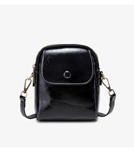 Black glossy small square crossbody bag for women, stylish shoulder bag with snap button.