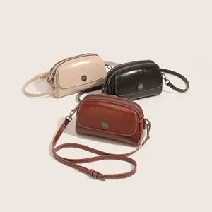 Vintage oil wax leather multi-compartment crossbody shoulder bag detail showcase, elegant style.