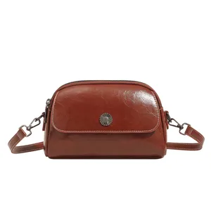 Vintage oil wax leather crossbody bag for women, stylish brown shell shoulder handbag.