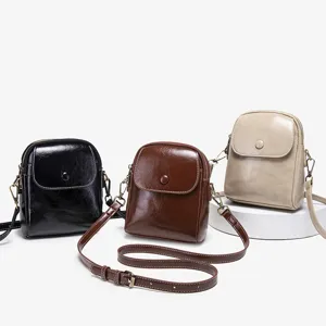 Trendy women's small square shoulder bag versatile crossbody bag with button closure