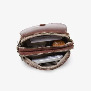 Brown PU leather small crossbody phone bag with double zippers and button flap open view.