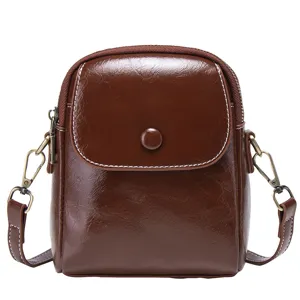 Stylish brown PU leather mini shoulder bag for women, perfect for daily casual wear.