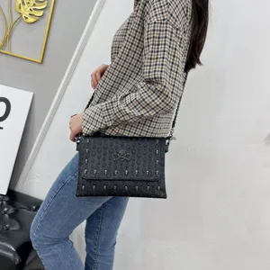 Punk style black skull embossed chain envelope bag for women, trendy cross-body bag.