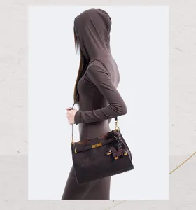 Retro suede shoulder bag for women with chic lock closure, brown crossbody tote bag.