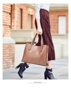 Detailed view of the stylish oil wax leather tote bag with sturdy handles and stitching.